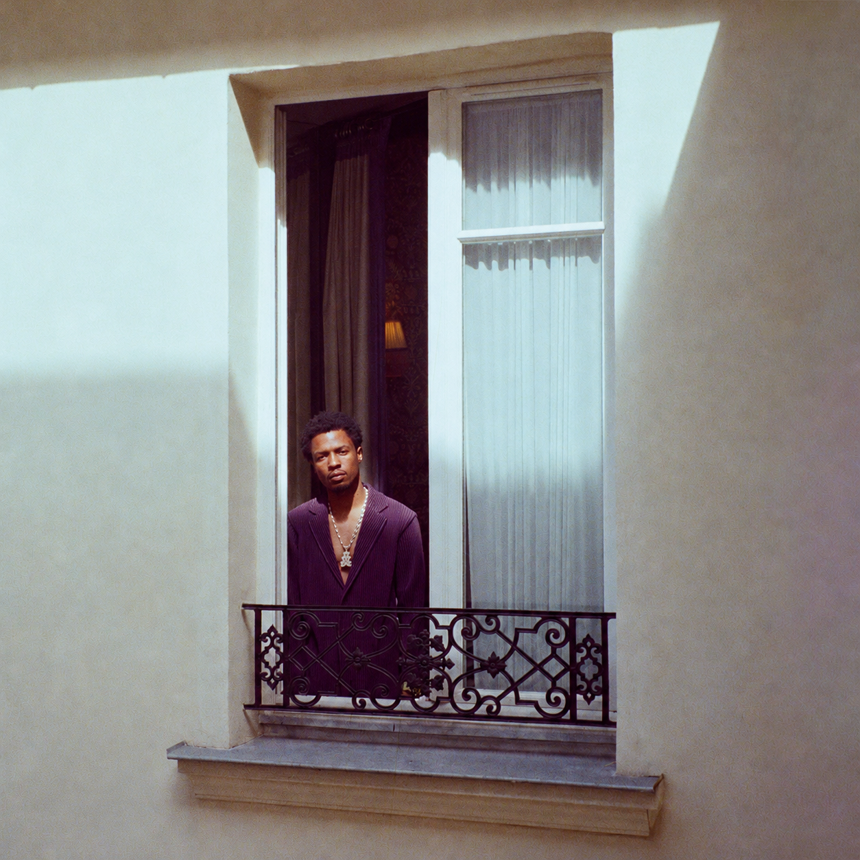 Vintage Balcony Portrait in Soft Sunlight.png